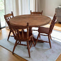 Classic Round Wooden Dining Table With Four Matching Spindle-Back Chairs