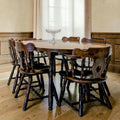 Dark Wood Oval Dining Table With Six Traditional Windsor-Style Wooden Chairs