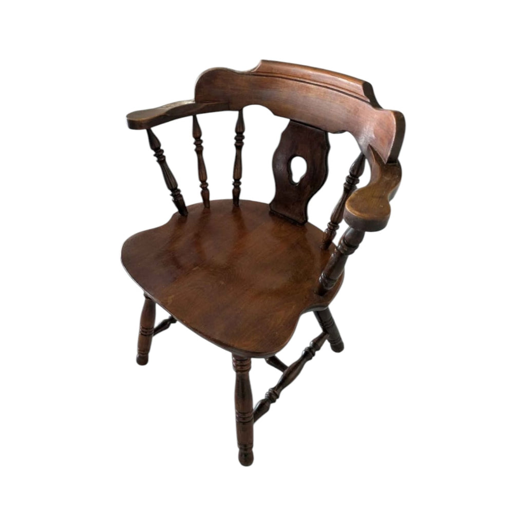 Dark Wood Oval Dining Table With Six Traditional Windsor-Style Wooden Chairs