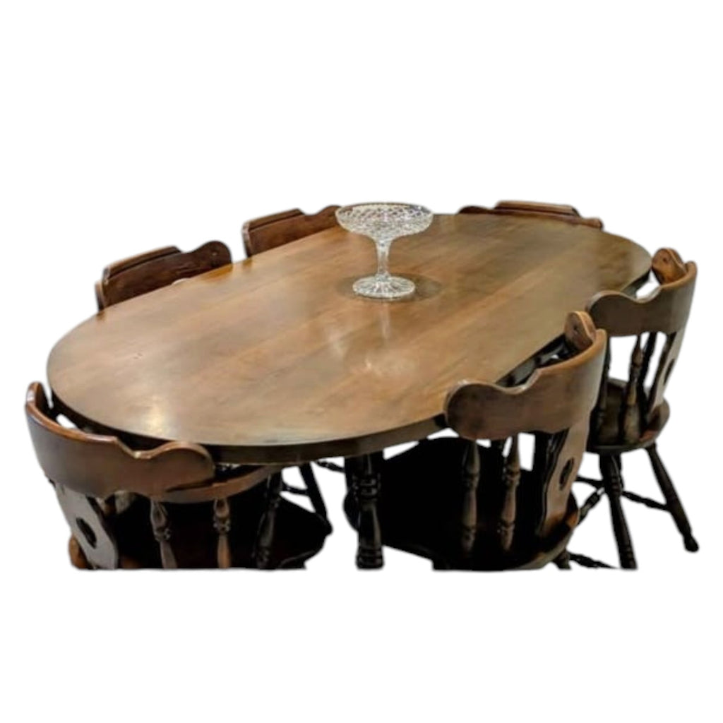 Dark Wood Oval Dining Table With Six Traditional Windsor-Style Wooden Chairs