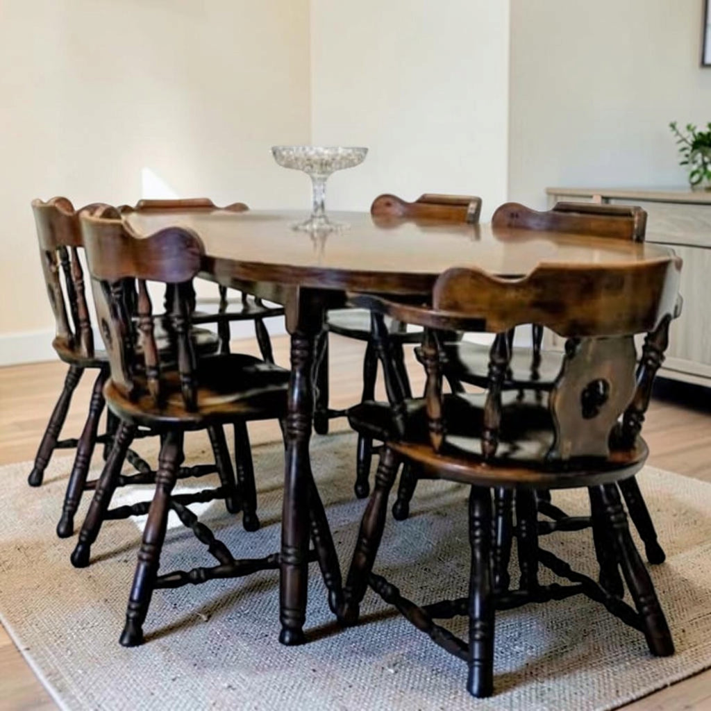 Dark Wood Oval Dining Table With Six Traditional Windsor-Style Wooden Chairs