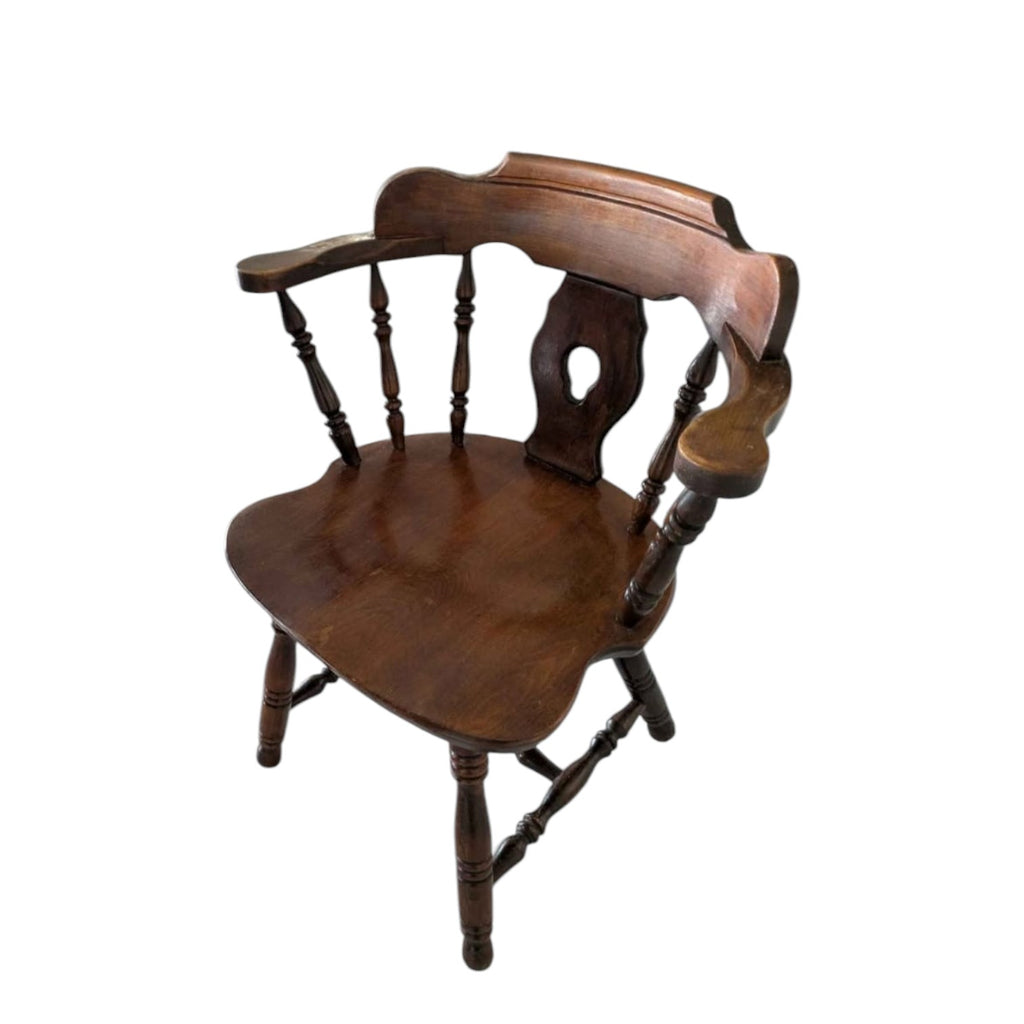 Dark Wood Oval Dining Table With Six Traditional Windsor-Style Wooden Chairs