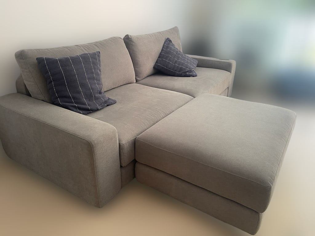 King Living Grey Fabric Modular Sofa With An Ottoman