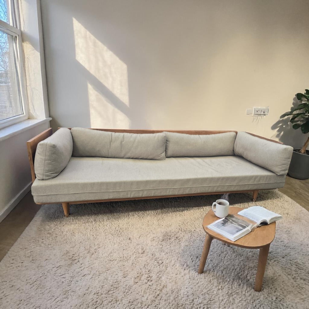 Modern Scandinavian Style Sofa Bed With A Light Wood Frame And Grey Upholstered Cushions X2 ($1300 Each)