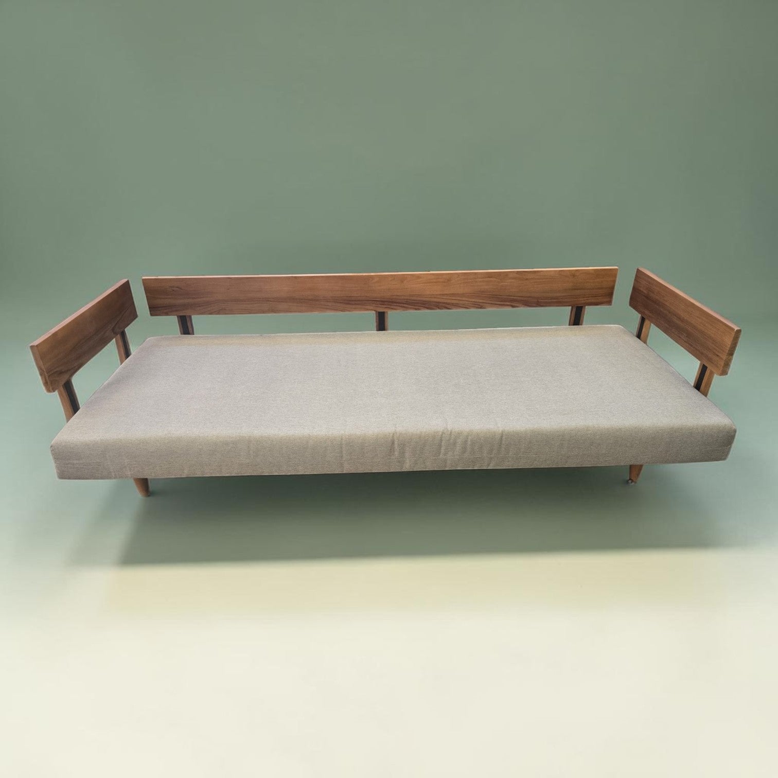Modern Scandinavian Style Sofa Bed With A Light Wood Frame And Grey Upholstered Cushions X2 ($1300 Each)