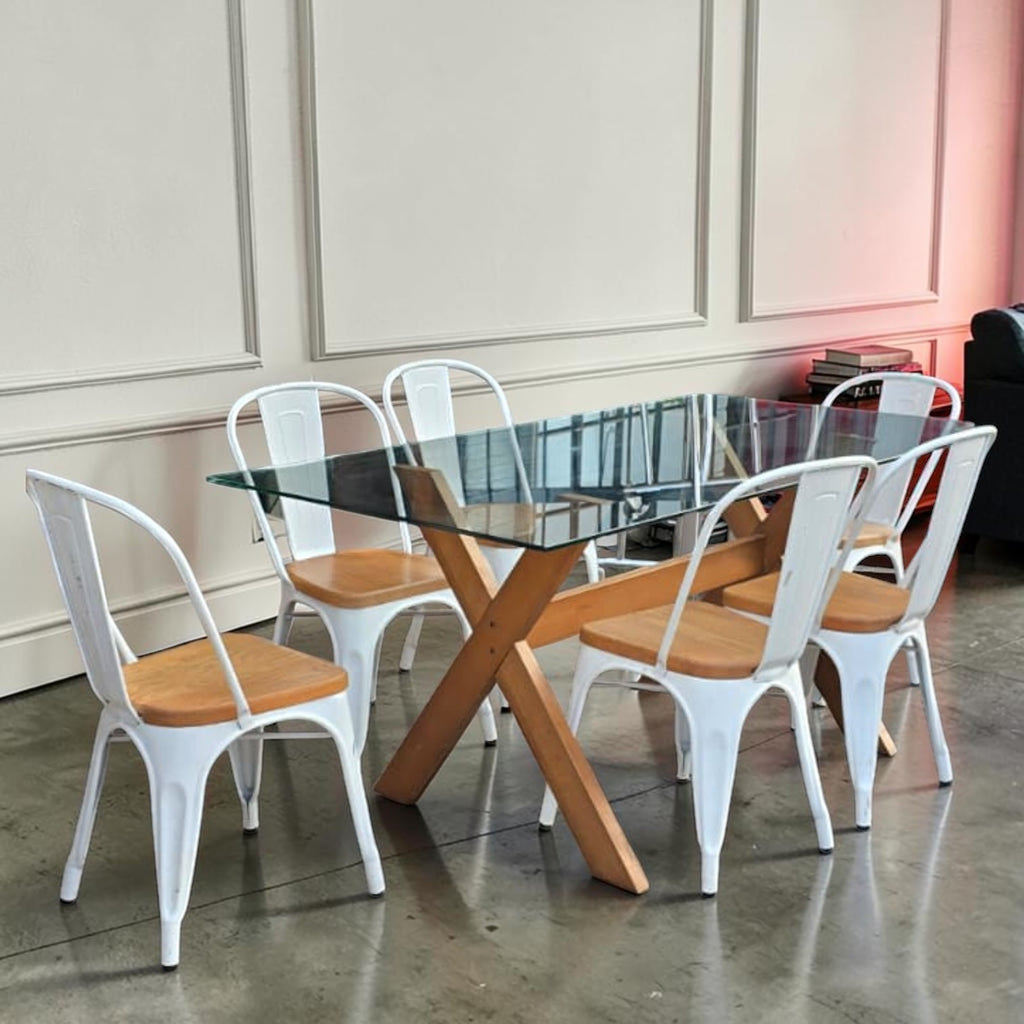 Wooden Table With A Glass Top Paired With Six White Metal And Wood Dining Chairs
