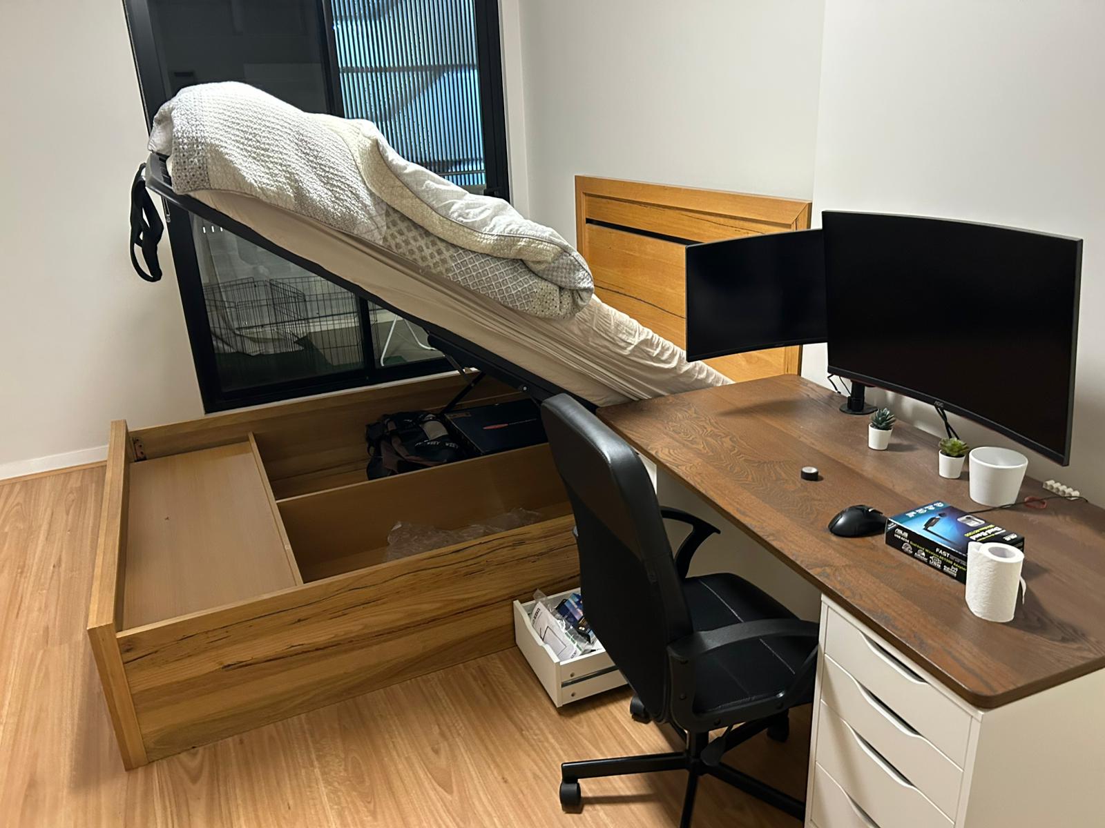 Storage bed with a lift-up mechanism